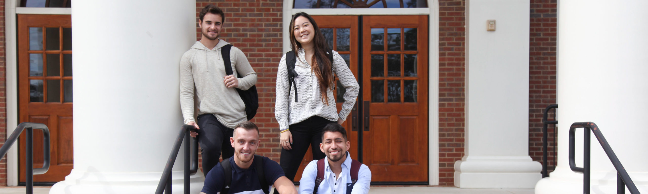 Business students in front of Smith-Bonvillian on Thomas University's campus